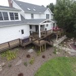 deck with walkway to the driveway along with a designated grilling station