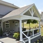 porch featuring a custom gable detail finished in white vinyl