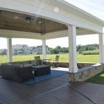 porch with wrap around stone sitting wall