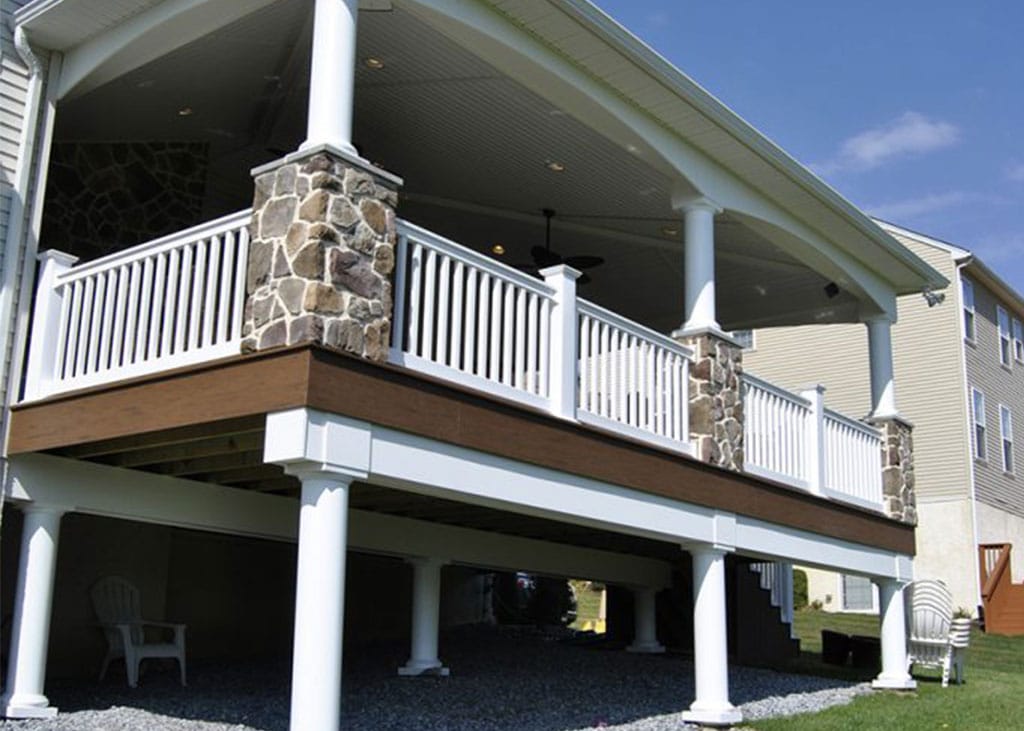 two story deck with outdoor storage space