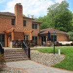 McElhaugh - flagstone patio with brick and staris with curved railing