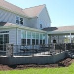 Barba - amazon mist TimberTech deck and porch with stonework