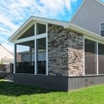 Barba - amazon mist TimberTech deck and screened porch with stonework