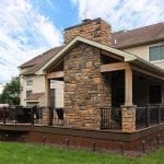 Beck - TimberTech deck and porch with stonework fireplace