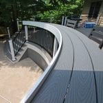 Brook - Pebble gray Trex deck with curved bar bumpout