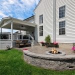 Canuso - Trex Deck and porch with patio and stonework fire pit