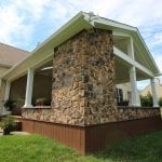 Geib - Brown Oak timbertech deck and porch with stonework