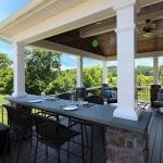 Soutner - Mocha TimberTech deck and porch with stone bar counter