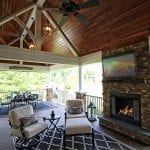 timbertech luxury porch with fireplace and furniture