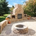 Casey - Flagstone patio with stonework fireplace and fire pit