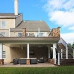 Casey - TimberTech deck with stonework and under deck oasis with TV