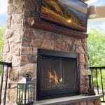 Berghuis - aspen fieldstone veneer tv and fireplace